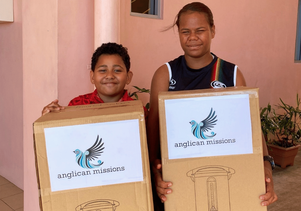 An image of two people holding supplies, symbolising what we do