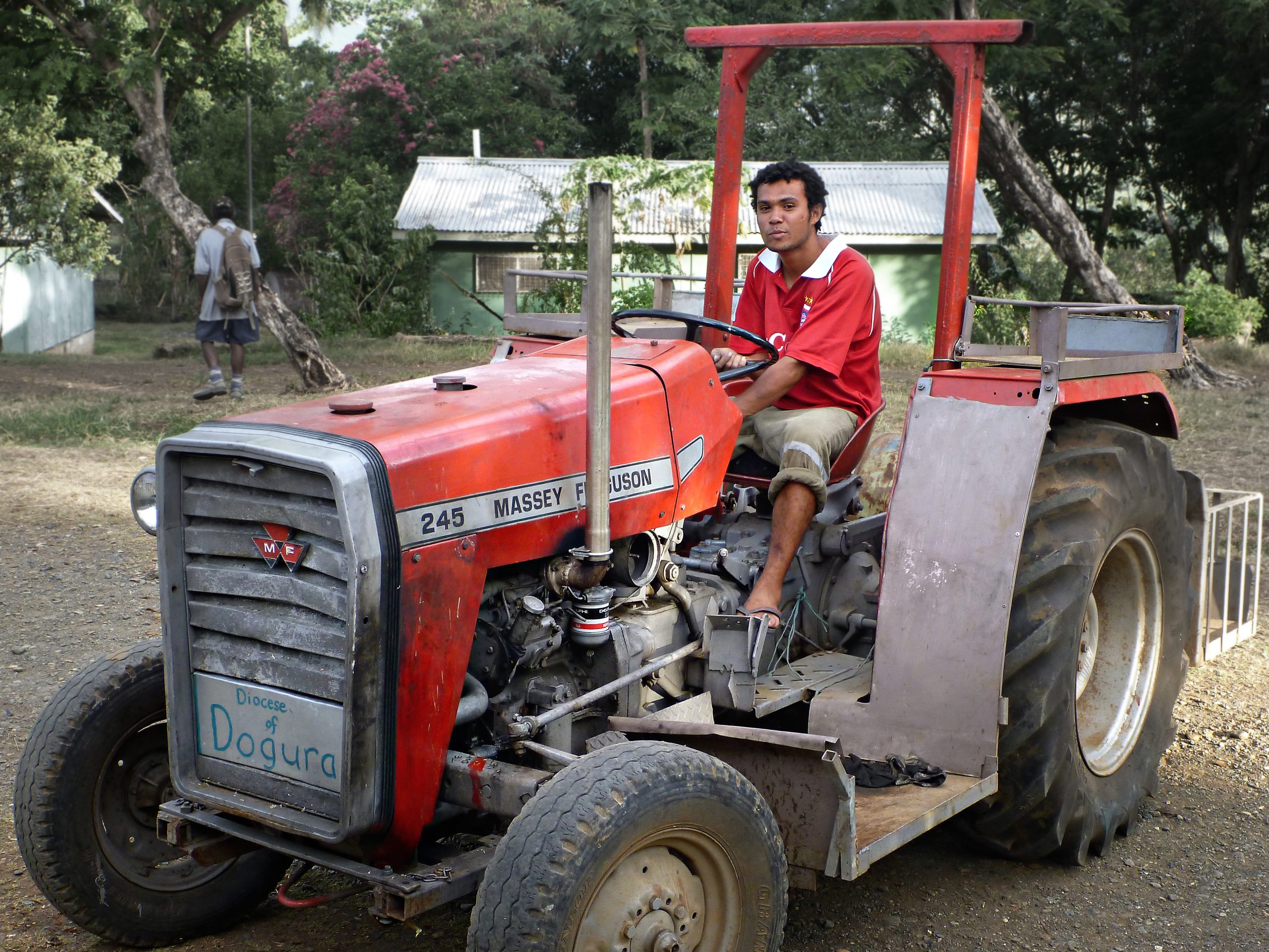 A person on a red tractor