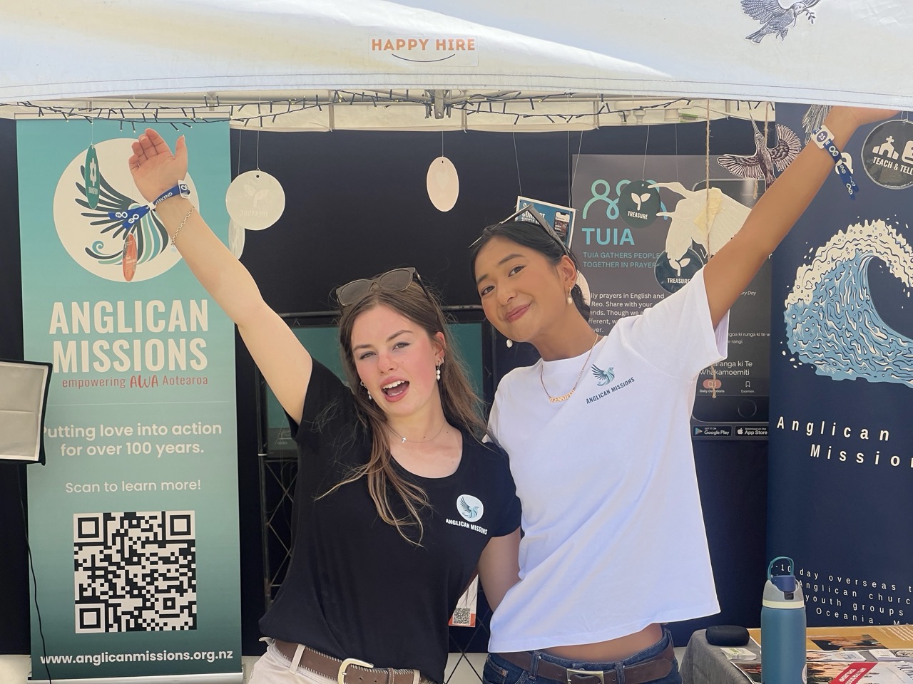 An image of two people who volunteer at an information kiosk, symbolising a way to get involved